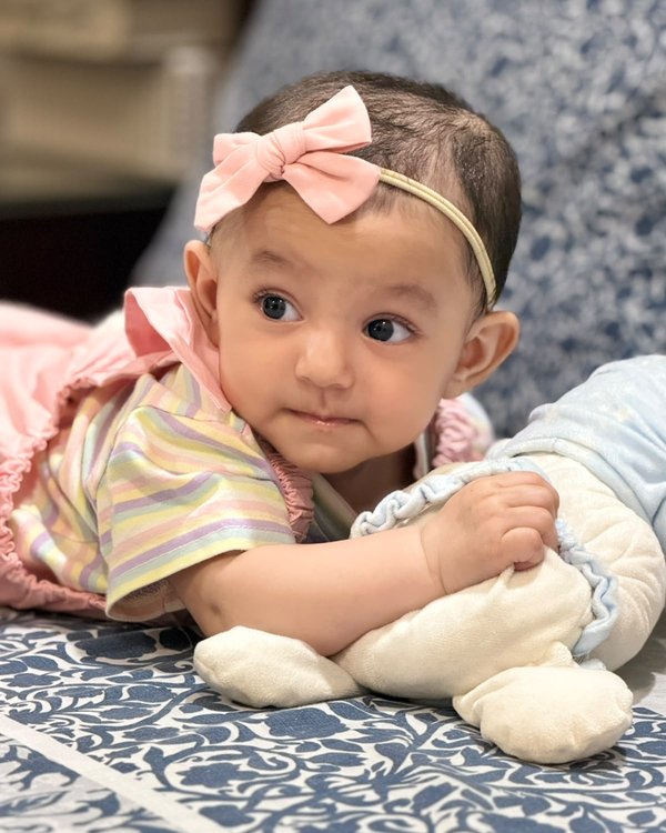 Nazia with a pink bow